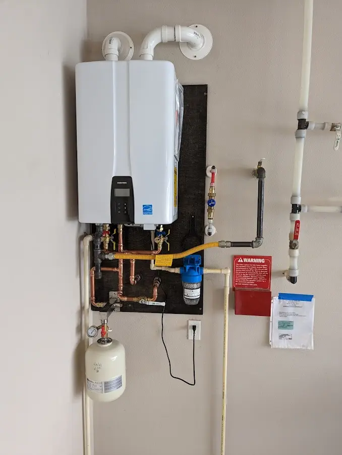 Professional plumber installing copper piping in a Sangaree home